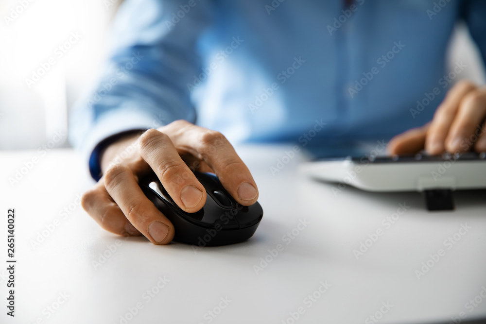 © ronstik - white collar work - man working with desktop computer in office closeup of hand clicking mouse