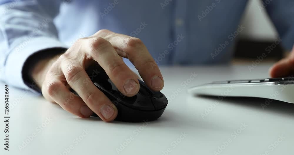 white collar work - man working with desktop computer in office closeup of hand clicking mouse