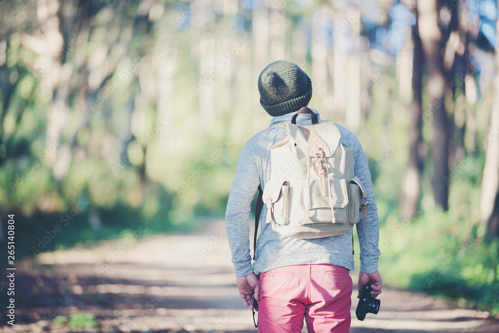 Young Man Traveler with backpack relaxing outdoor with rocky mountains on background Summer vacations and Lifestyle hiking concept. Young Man Traveler with backpack relaxing outdoor with rocky mountains on background Summer vacations and Lifestyle hiking concept.
