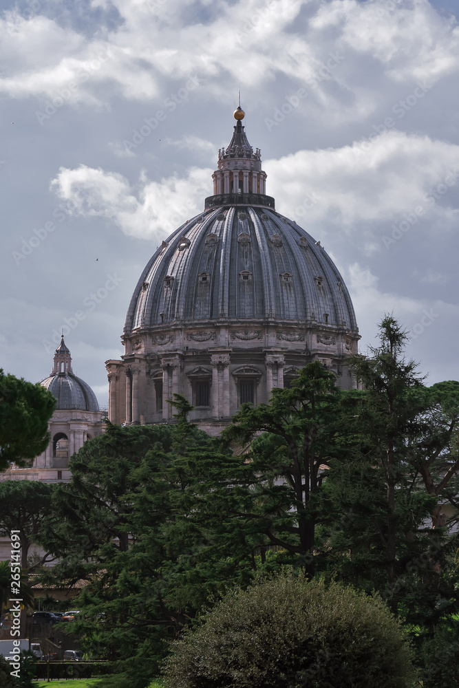 VATICAN - march, 2019: Vatican gardens view with St. Peter's Basilica dome behind the trees, Vatican, Rome