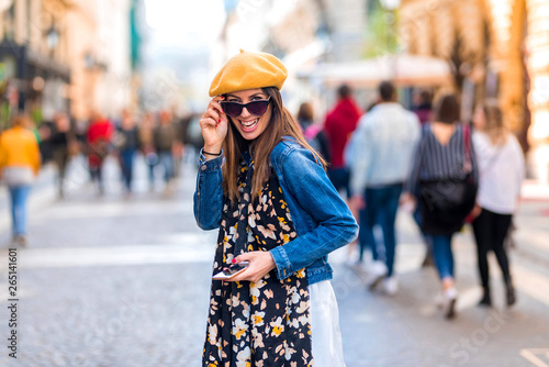 A cheerful young woman in the pedestrian zone photo