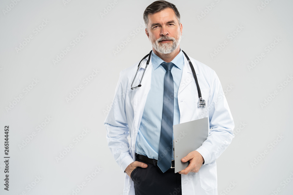 Cheerful mature doctor posing and smiling at camera, healthcare and medicine. Cheerful mature doctor posing and smiling at camera, healthcare and medicine.