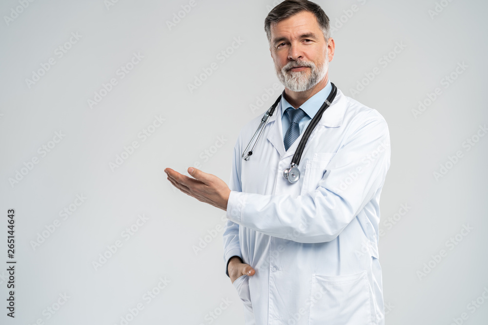 Doctor senior man, medical professional holding something in empty hand isolated over white background. Doctor senior man, medical professional holding something in empty hand isolated over white background.