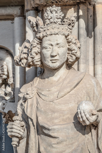 Wall figure of queen at main facade of cathedral in Magdeburg, Germany