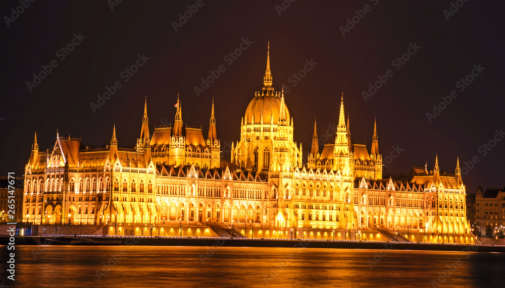 The picturesque view of of the Parliament in Budapest, Hungary, Europe in evening on lamps light