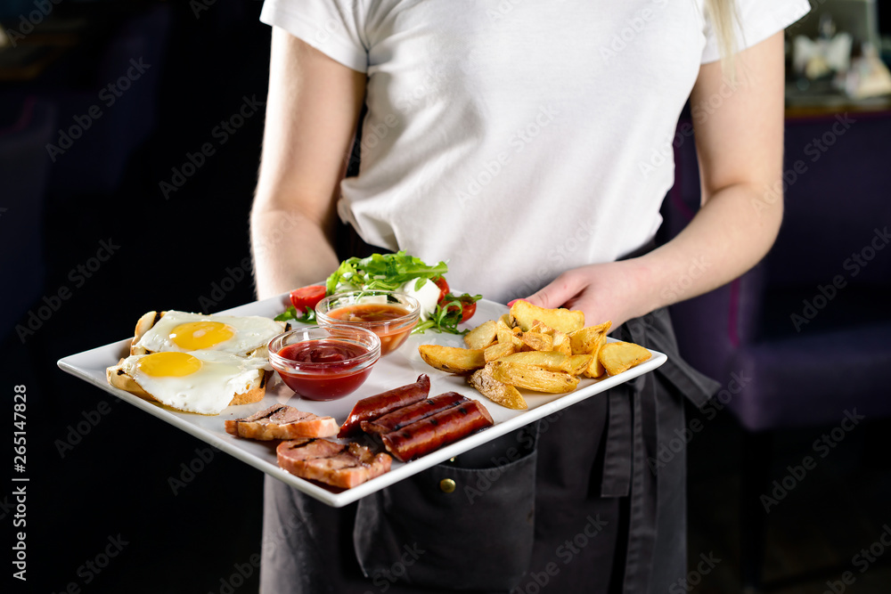 Waitress serving breakfast at a restaurant