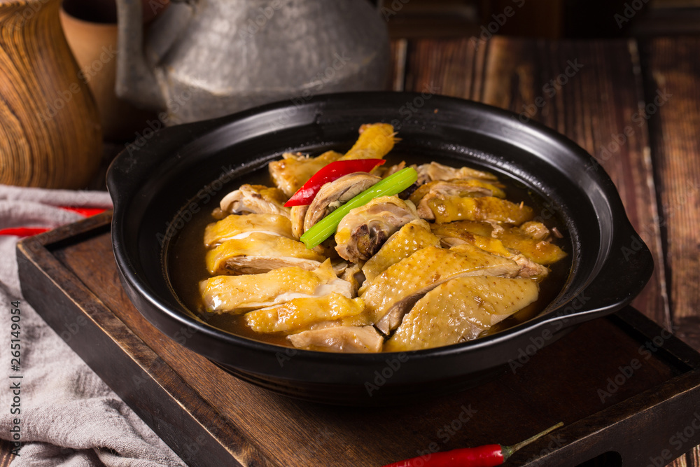 Stewed chicken used rice wine in a black ceramic dish Stewed chicken used rice wine in a black ceramic dish