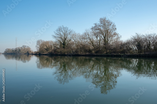 Tree reflections in calm canal waters © Lisa