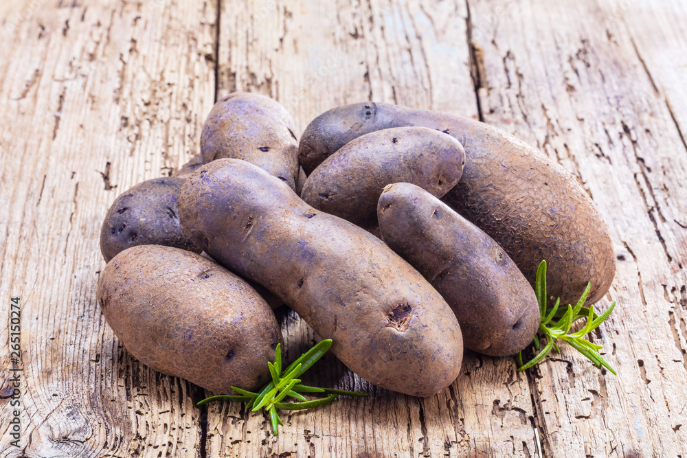 Vitolette noir or purple potato. On a white background. Vitolette noir or purple potato. On a white background.