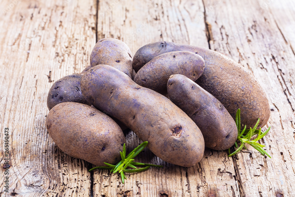 Vitolette noir or purple potato. On a white background. Vitolette noir or purple potato. On a white background.