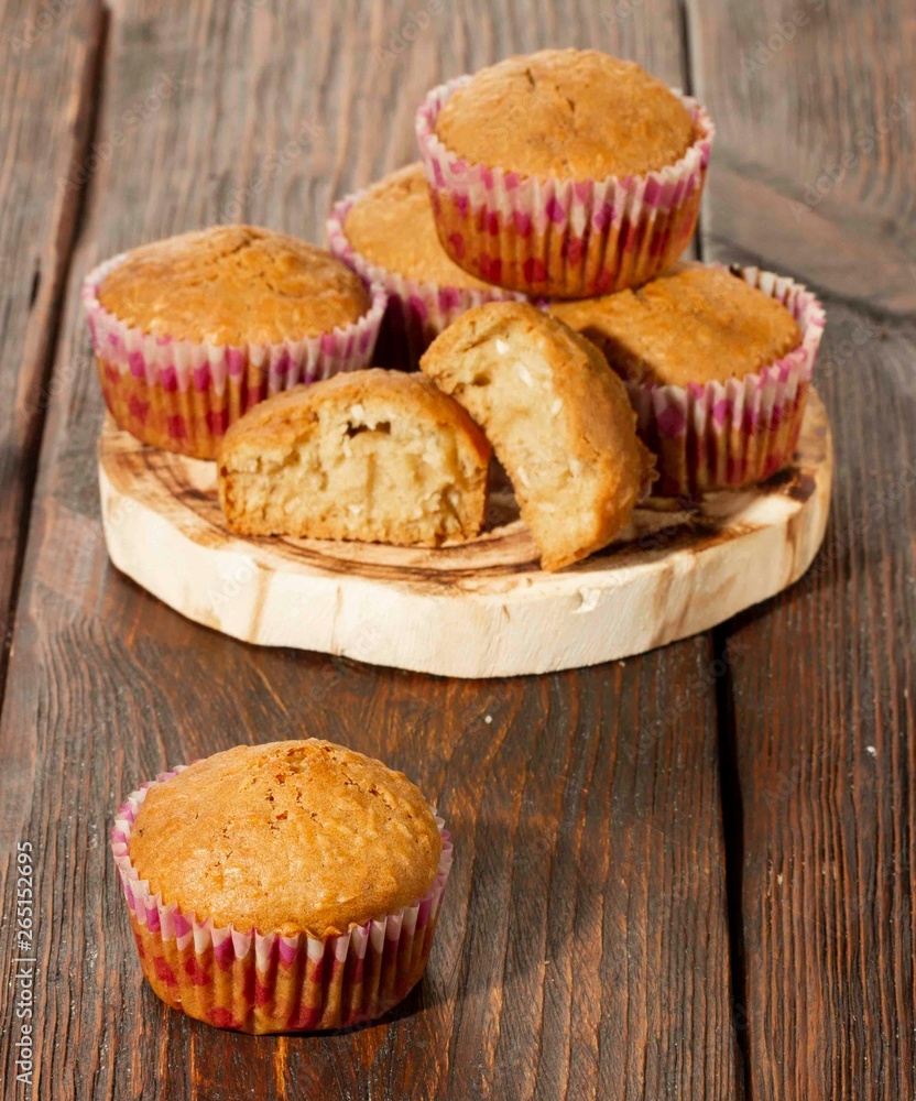 Vanilla cupcake, homemade pastry on wooden background Vanilla cupcake, homemade pastry on wooden background