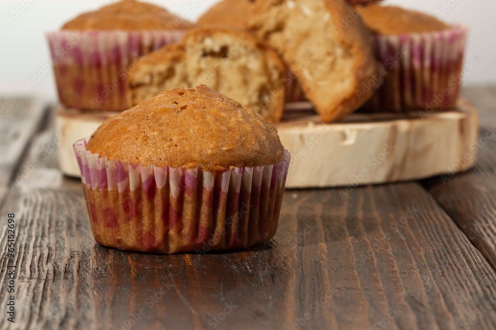 Vanilla cupcake, homemade pastry on wooden background Vanilla cupcake, homemade pastry on wooden background