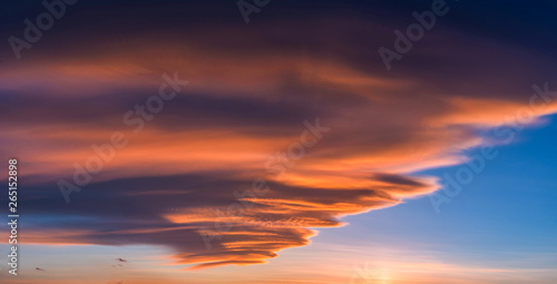 Colorful dramatic sky with cloud at sunset. © nuttawutnuy
