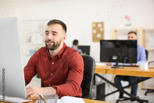 Young man working in office...