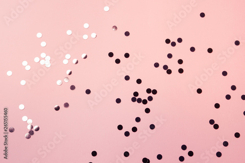 Sparkling confetti on pink coral pastel background