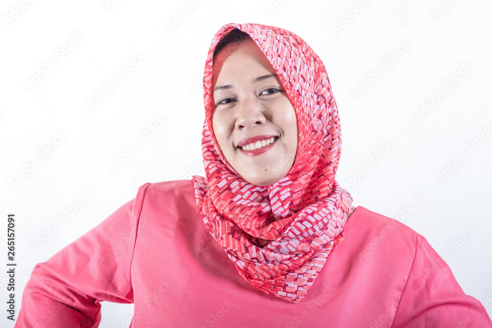 Portrait of muslim business woman smiling girl, posing at white studio background. Young emotional woman. The human emotions, facial expression concept. Front view Portrait of muslim business woman smiling girl, posing at white studio background. Young emotional woman. The human emotions, facial expression concept. Front view