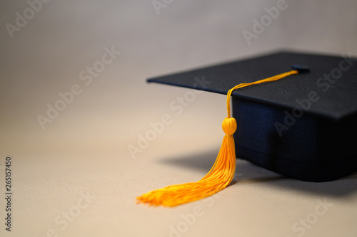 Black Graduation Hat placed on brown paper
