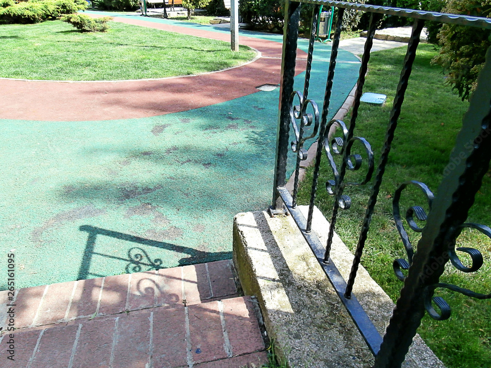Park with walking path. View from stairs. Park with walking path. View from stairs.