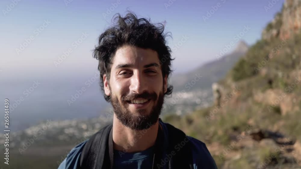 Closeup Portrait Of Smiling Male Hiker On Mountain Closeup Portrait Of Smiling Male Hiker On Mountain