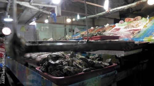 Fresh sea fish placed on ice in the marketFresh Sea Fish in Shop. Seafood In Ice On The Counter Market. Fish sold on the street. Fish market in Manila,Philippines.