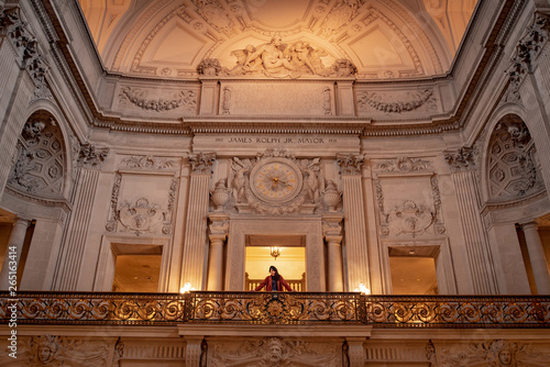 Asian woman standing in San Francisco City Hall  one of travel attractions where reconstruction after earthquake in San Francisco  California  USA.