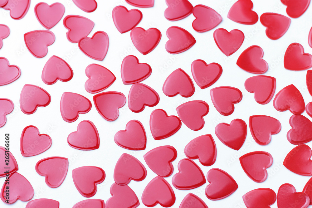 Red hearts confetti on white background, romance concept