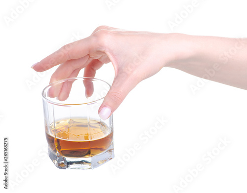 Glass with cognac brandy alcohol in hand on a white background. Isolation