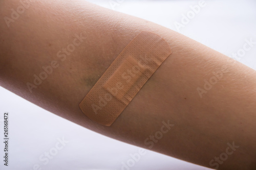 adhesive plaster on injury after blood test injection
