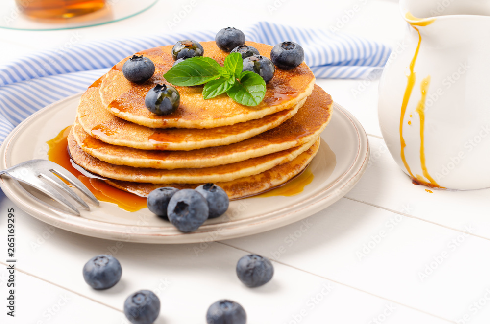 Stack of pancakes with fresh blueberry and caramel syrup Stack of pancakes with fresh blueberry and caramel syrup