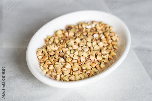 Buckwheat grains on a white plate