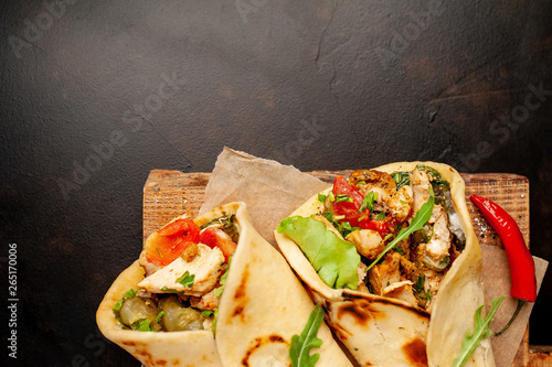 delicious mexican tacos with salad on concrete background. mexican cuisine