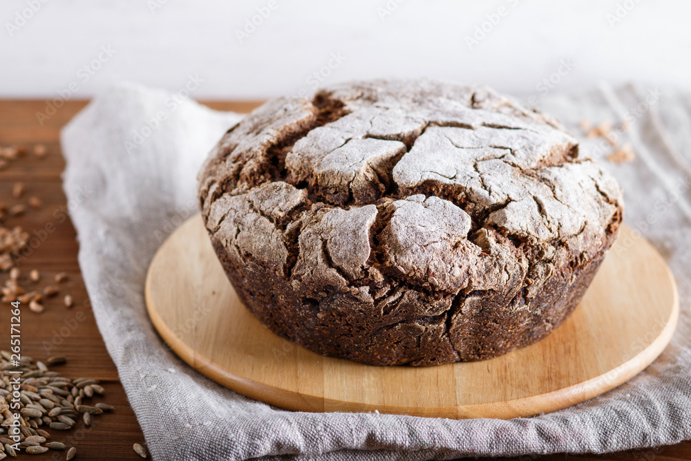 Yeast free homemade bread with whole rye and wheat grains on rustic wooden background. Yeast free homemade bread with whole rye and wheat grains on rustic wooden background.