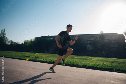 sprinter runs fast on a treadmill at the stadium