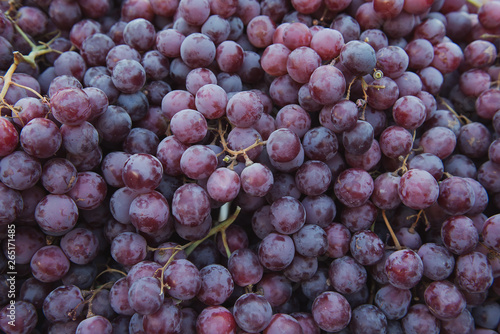 A lot of delicious grapes at the market. Organic and healthy. Fruit background.