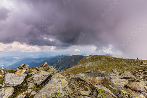 Beautiful cloudy landscape in the Alps, in summer © Calin Tatu