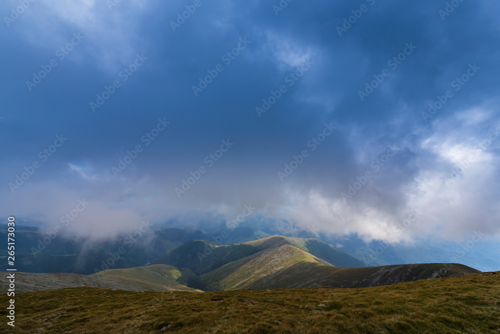 Beautiful cloudy landscape in the Alps, in summer