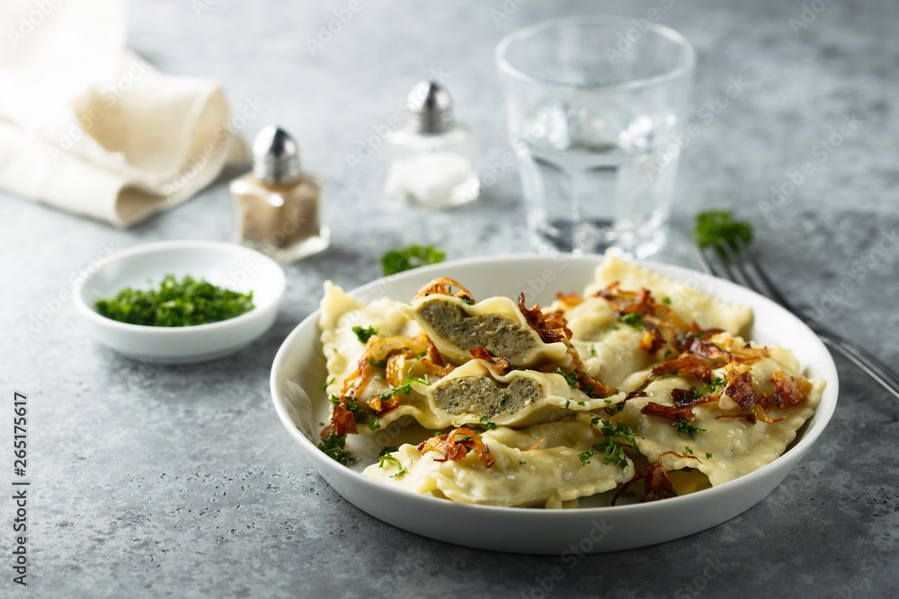 Traditional German dumplings with fried onion and herbs Traditional German dumplings with fried onion and herbs