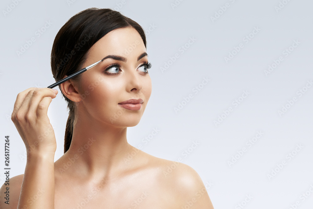 Beautiful woman face close up studio on white Beautiful woman face close up studio on white