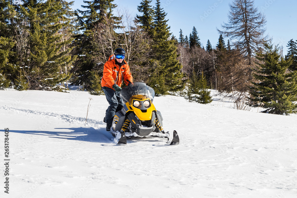 Athlete on a snowmobile.