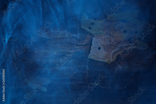 various natural patterns on the bark of a pine tree covered with blue night fog concept mystics and halloween
