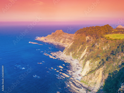 Aerial view of ocean and rocky coast at sunset. Galicia, Spain