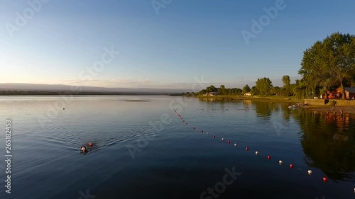 lifeguard swimming in argentine lake back