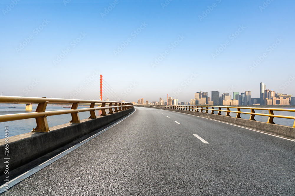 road with city skyline
