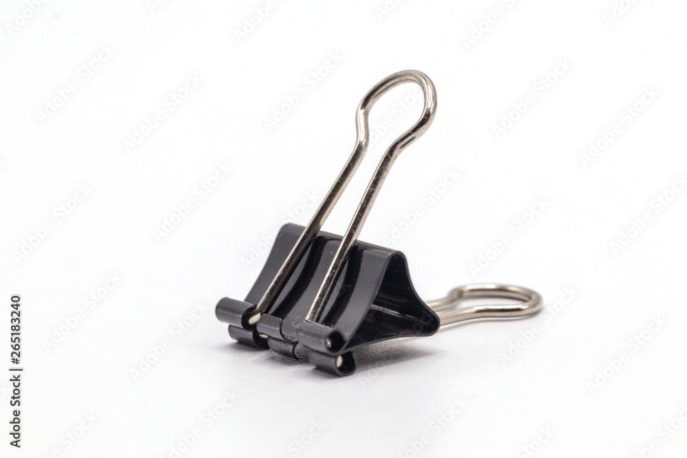 Close up black paper clip isolate on white background.Selective object on white. Close up black paper clip isolate on white background.Selective object on white.