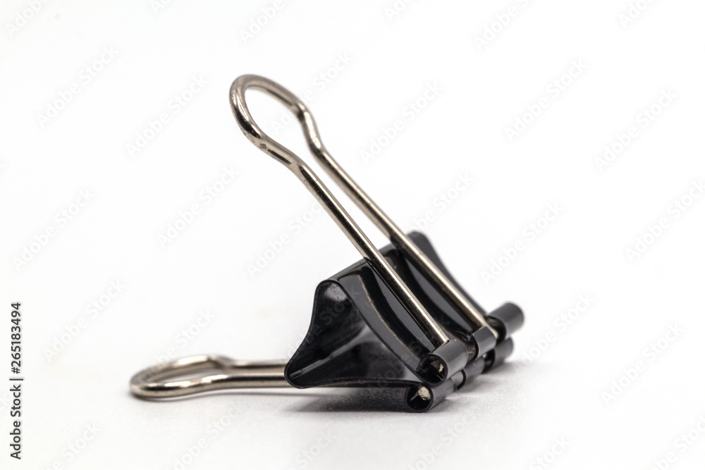 Close up black paper clip isolate on white background.Selective object on white. Close up black paper clip isolate on white background.Selective object on white.