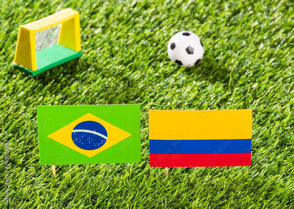 Fototapeta premium Flag of Brazil and Colombia in the football stadium - Copa América football tournament conmebol Brazil