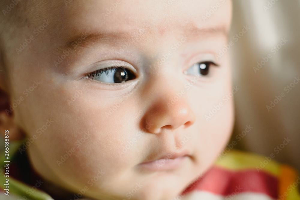 Close-up of the look of a funny baby. Close-up of the look of a funny baby.