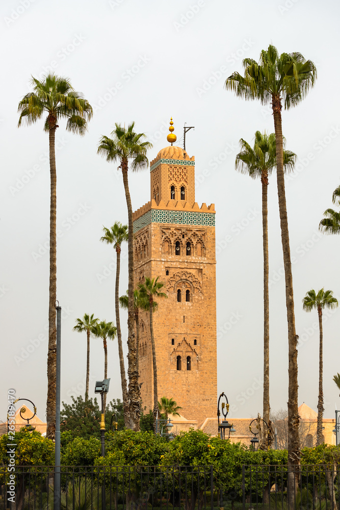 Koutoubia mosque in Marrakesh, Morocco, surrounded by palm trees