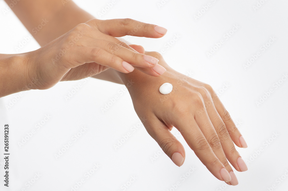 Cosmetics concept. Woman applying hand cream, white background, Cosmetics concept. Woman applying hand cream, white background,