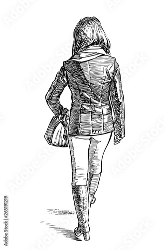 A casual townswoman goes down the street